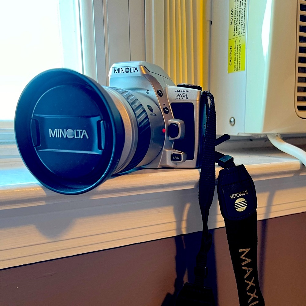 Minolta 35mm film camera with AF 28-80 zoom lens. Maxim HT TSI Plus